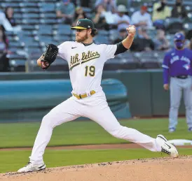  ?? Carlos Avila Gonzalez / The Chronicle ?? A’s starting pitcher Cole Irvin allowed three hits and one run in eight innings, lowering his ERA from 3.67 to 3.09.