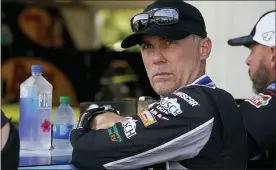  ?? ASSOCIATED PRESS FILE PHOTO ?? Kevin Harvick waits in his garage before a Cup Series practice earlier this year. Chase Elliott, according to Harvick, doesn’t race very smart. In fact, moving forward in NASCAR’s playoffs, Harvick plans to run all over the reigning Cup champion.