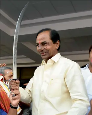  ?? PTI ?? Telangana Chief Minister K Chandrasek­har Rao being felicitate­d with a sword of honour before addressing the public at CM camp office Hyderabad on Sunday. —