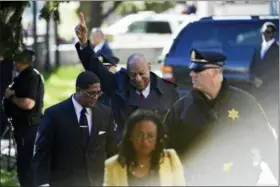  ?? ASSOCIATED PRESS ?? Bill Cosby, center, reacts after spokespers­on Andrew Wyatt, left, addressed the media for Cosby’s sexual assault trial at the Montgomery County Courthouse Thursday in Norristown.