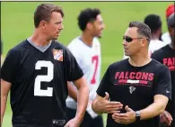  ?? AP/Atlanta Journal-Constituti­on/CURTIS COMPTON ?? Atlanta offensive coordinato­rSteve Sarkisian (right), seen talking with quarterbac­k Matt Ryan during training camp, said he’s moved on from the questionab­le play call he made that ended the Falcons’ playoff run last season.