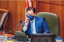  ?? EDDIE MOORE/JOURNAL ?? House Speaker Brian Egolf, D-Santa Fe, talks with Republican leadership during debate on a civil rights bill in the House this week.