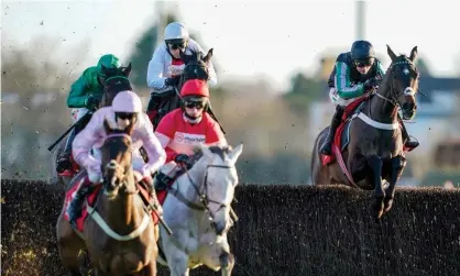  ??  ?? Nico de Boinville riding Altior (right) on their way to finishing second in the Desert Orchid Chase at Kempton. Photograph: Alan Crowhurst/Getty Images