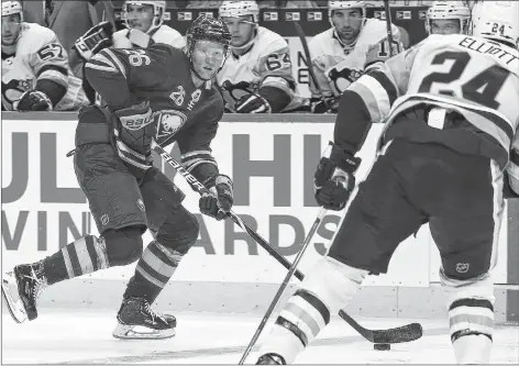  ?? AP PHOTO ?? Buffalo Sabres defenceman Rasmus Dahlin brings the puck into the Pittsburgh Penguins zone during an NHL pre-season hockey game in Buffalo N.Y., on Sept. 18.