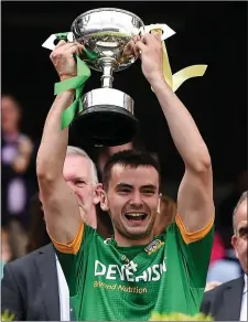  ??  ?? Daire Rowe of Meath lifts the cup after victory in the Leinster Junior Championsh­ip Final.