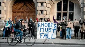  ?? GETTY IMAGES ?? Protesters march to Oriel College’s statue of Cecil Rhodes at the University of Oxford in May. Activists in the UK and South Africa have called for the removal of statues in his honour, arguing that Rhodes is the embodiment of white supremacy.