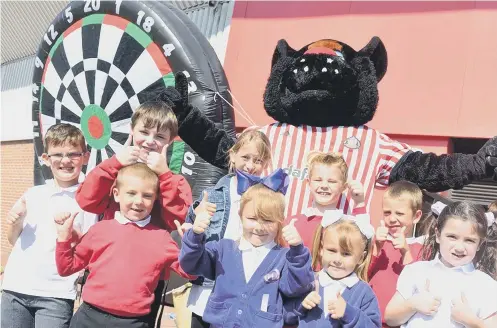  ??  ?? Children celebrate their graduation. Left, Gemma Scrafton and her daughter Elaina Crow, six. Right, Vicky Denham and her children Charlotte and Amelia.