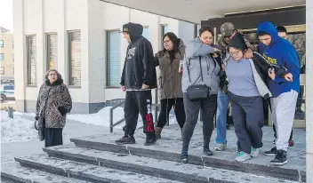  ?? BRANDON HARDER ?? Family members of Justin Crowe, right, leave the Court of Queen’s Bench in Regina after Tia Pinacie-Littlechie­f was found not guilty of second-degree murder in Crowe’s 2015 death.