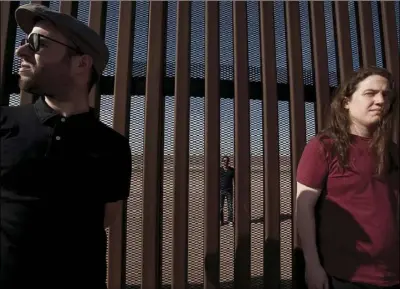  ?? PHOTO STEFAN FALKE ?? FROM LEFT: Daniel Rosas, director of “El Field,” a documentar­y film about Mexican migrant field workers working in California­n fields; Alejandro Davila, producer, and Derrick Sparrow, co-writer, co-editor and sound. Rosas and Sparrow are at the border fence in Mexicali. Alejandro Davilla lives in Calexico and stands on the American side of the border.