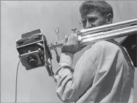  ?? Dorothea Lange
Oakland Museum of California, g if t of Paul S. Taylor ?? A LINK TO A DEFINING ERA Partridge in a 1954 photo by another of his mentors, Doro
thea Lange. He was her darkroom assistant and driver.