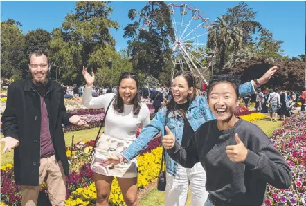  ?? Picture: Kev Farmer ?? 30-DAY FLOWER FEST: This year’s Carnival of Flowers is set go all September so locals and visitors like (from left) Bryce Unwin, Keely Lynch, Kate Doherty and Kathy Kwan can enjoy spring all month long.