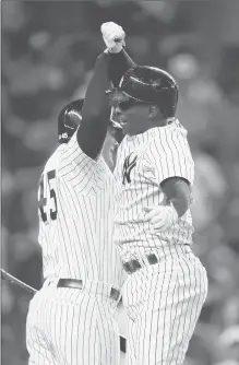  ?? MIKE STOBE | GETTY IMAGES ?? DIDI GREGORIUS celebrates a two-run home run in the first inning against the Baltimore Orioles at Yankee Stadium on Friday.