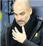  ??  ?? Pep Guardiola wearing his ribbon