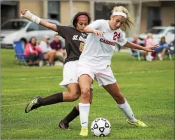  ?? RICK KAUFFMAN — DIGITAL FIRST MEDIA ?? Archbishop Carroll’s Bella Sorrentino, right in this file Monday as the Patriots tripped up Cardinal O’Hara. photo, assisted on both Carroll goals