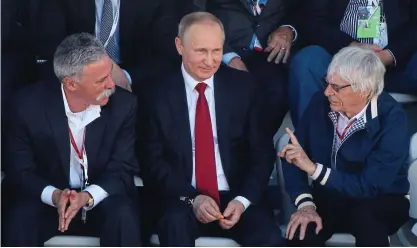  ?? GETTY IMAGES ?? Cutting to the the chase: Ecclestone (right) with Casey (left) and President Putin in Sochi