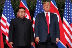  ?? (AP/Evan Vucci) ?? President Donald Trump stands with North Korean leader Kim Jong Un on Sentosa Island in Singapore in 2018. North Korea reiterated Saturday that it has no immediate plans to resume nuclear talks with the U.S. unless Washington ends what its “hostile” polices toward Pyongyang.