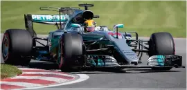  ?? Photograph: PA ?? Lewis Hamilton turns at the Senna Corner