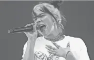  ?? JACK PLUNKETT/INVISION/AP ?? In this 2019 file photo, Billie Eilish performs during the first weekend of the Austin City Limits Music Festival in Austin, Texas.