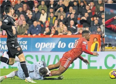  ?? ?? Luis ‘Duk’ Lopes goes down in the United box to win Aberdeen the crucial penalty