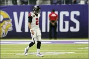  ?? JIM MONE — THE ASSOCIATED PRESS ?? Atlanta Falcons quarterbac­k Matt Ryan walks to the sideline during the first half of an NFL football game against the Minnesota Vikings, Sunday in Minneapoli­s.