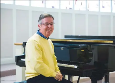  ?? KELVIN GREEN/RIVER VALLEY & OZARK EDITION ?? Tim Gunter, who started this week as the new Central Baptist College director of bands, sits at a piano on the Conway campus. The college, which hasn’t had a band for several years, will launch a band program this fall. Gunter will create the program...