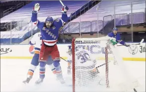  ?? Bruce Bennett / Associated Press ?? The Rangers’ Mika Zibanejad celebrates a first- period goal by Pavel Buchnevich, not seen, against the Islanders on Saturday.