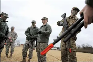  ?? Arkansas Democrat-Gazette/THOMAS METTHE ?? Cadet squad leader Brooks Boshears (center) gives instructio­ns to fellow University of Central Arkansas ROTC cadets during a training exercise on Feb. 1 at the UCA intramural fields in Conway.