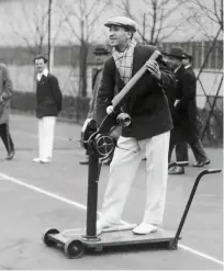  ??  ?? René Lacoste in 1927 with the tennis ball launcher he invented; and receiving the Championsh­ip Cup for winning that year’s US Open, in Forest Hills, NY