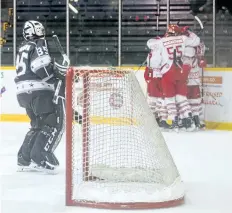  ?? BOB TYMCZYSZYN/STANDARD STAFF ?? The St. Catharines Falcons celebrate after scoring a goal on the Caledonia Corvairs Friday.