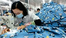  ?? AP ?? China’s exporters have benefited from the relatively early reopening of the second-largest global economy from Covid lockdowns. —