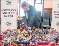  ??  ?? Lisa Bond adds the finishing touches to her tableau of knitted hamsters