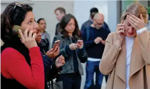  ?? AFP ?? FEAR OVER THE CITY: People react near Parsons Green tube station in London —