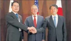  ?? REUTERS ?? (From left) South Korea's defence minister Song Youngmoo, US secretary of defence Jim Mattis and Japan's defence minister Itsunori Onodera on the sidelines of the Shangrila Dialogue.