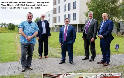  ?? ?? Health Minister Robin Swann (centre) and Tom Elliott, UUP MLA (second-right) on a visit to South West Acute Hospital.