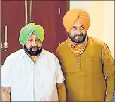  ?? PTI ?? Punjab CM Amarinder Singh with state Congress chief Navjot Singh Sidhu in Chandigarh on August 20.