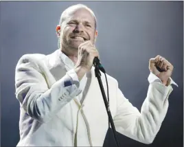  ?? CP PHOTO ?? Gord Downie sings during the band’s performanc­e at the Concert for Toronto at Skydome.