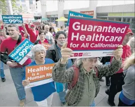  ?? Rich Pedroncell­i Associated Press ?? THE ANNUAL COST of a single-payer healthcare system for California was estimated at $400 billion. Above, demonstrat­ors march to the Capitol in April.