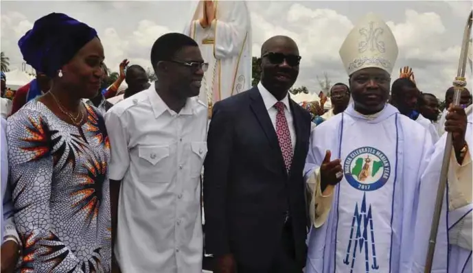  ??  ?? R-L: President, Catholic Bishops Conference of Nigeria and Archbishop of Jos, Most Reverend Ignatius Kaigama; Edo State governor, Mr. Godwin Obaseki; Edo State deputy governor, Hon. Philip Shiabu and his wife, Maryann, during the grand finale of the...