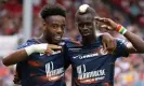 ?? Venance/AFP/Getty Images ?? Elye Wahi (left) celebrates scoring his second and Montpellie­r’s fifth goal with teammate Falaye Sacko. Photograph: Loïc