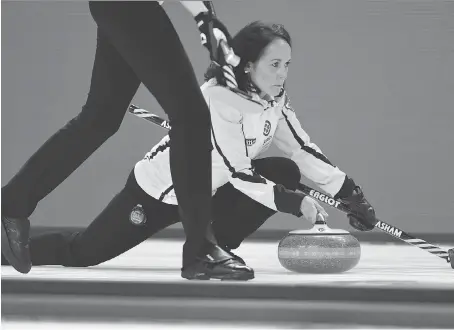  ?? SEAN KILPATRICK/THE CANADIAN PRESS ?? Manitoba skip Michelle Englot delivers a stone during a match against British Columbia at the Scotties Tournament of Hearts in St. Catharines, Ont., on Thursday. Englot’s 9-1 rink faced the only team with a better record — 10-0 Ontario — on Thursday...