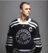  ?? BLACKHAWKS ?? Jonathan Toews models the Blackhawks’ throwback Winter Classic jersey.