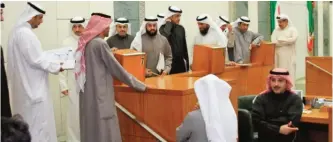  ??  ?? KUWAIT: Newly-elected MPs are pictured inside the parliament’s building, where they were taken on a tour yesterday ahead of the inaugural session next Sunday.— Photo by Yasser Al-Zayyat