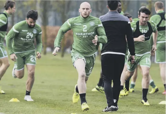  ??  ?? 2 David Gray, who recently signed a new four-year deal with Hibs, is put through his paces in training as Paul Heckingbot­tom’s squad stepped up preparatio­ns for Sunday’s derby clash with Hearts.