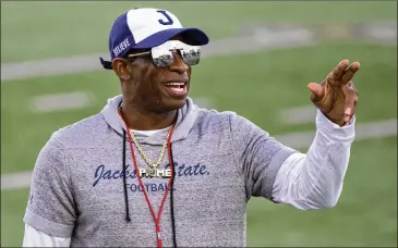  ?? MATTHEW HINTON/AP 2021 ?? Jackson State head coach Deion Sanders (above) led the school to its first SWAC title in 14 years, with his son, freshman Shedeur Sanders, playing quarterbac­k. That’s as good a reason as any to watch South Carolina State vs. Jackson State in the Celebratio­n Bowl in Atlanta.