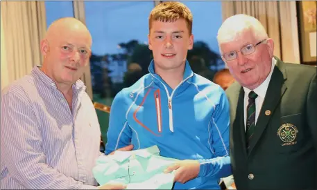  ??  ?? Prize-winner Niall O’Callaghan with Paul Teague of Open Hydro (sponsor) at the Greenore Presentati­on Night.