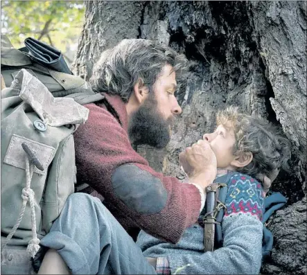  ?? Jonny Cournoyer Paramount Pictures ?? LEE ABBOTT (John Krasinski) and son Marcus Abbott (Noah Jupe) try to avoid detection in the nearly dialogue-free “Quiet Place.”