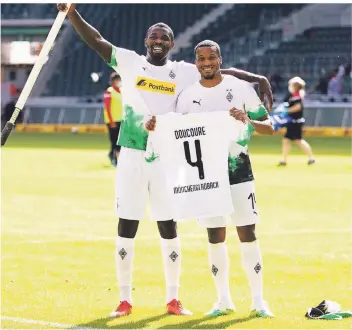  ?? FOTO: FOTOPOOL/DIRK PÄFFGEN ?? Marcus Thuram (links) plus Alassane Plea gleich 20 Tore plus X für Platz vier aufwärts: Das ist eine Formel in Borussias Champions-League-Rechnung.