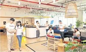  ??  ?? Globish Academia staff operate out of WeWork Spring Tower in the Ratchathew­i district of Bangkok.