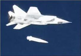  ?? RU-RTR RUSSIAN TELEVISION ?? In this video grab released by RU-RTR Russian television on Thursday, a Russian MiG-31 fighter jet releases the new Kinzhal hypersonic missile during a test at an undisclose­d location in Russia.