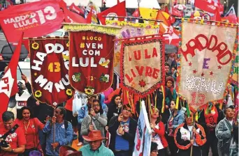  ?? AFP ?? Supporters of candidate for the Workers’ Party Fernando Haddad take part in a campaign rally in downtown Sao Paulo. Brazilians vote in the country’s presidenti­al elections today.